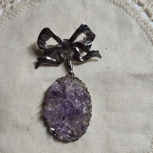 Elegant Silver and Amethyst Bow Pendant